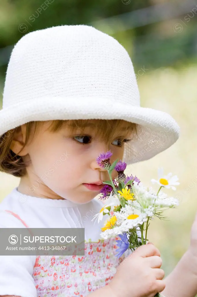 Girl in a meadow in bloom Southern Alps France