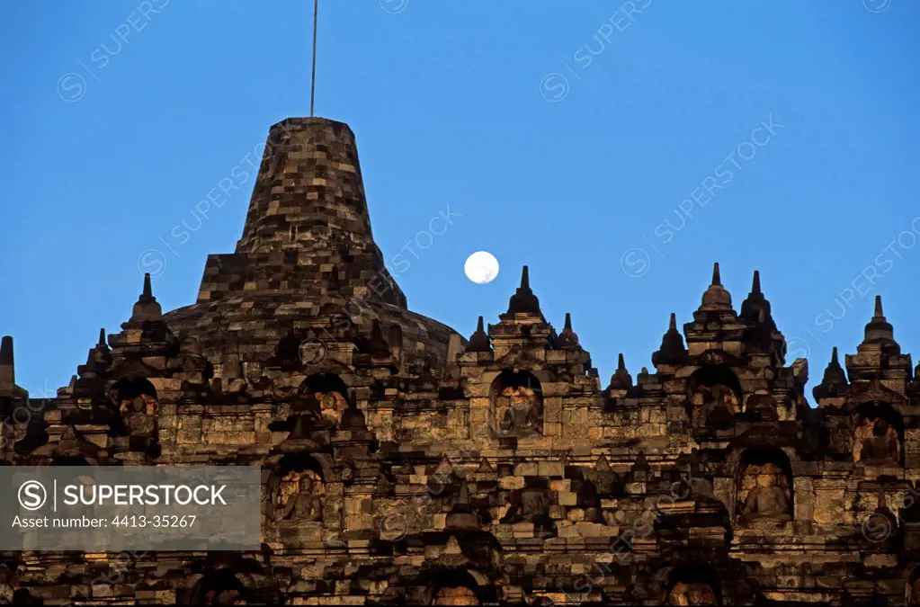 Moon setting behind Borobudur temple Indonesia