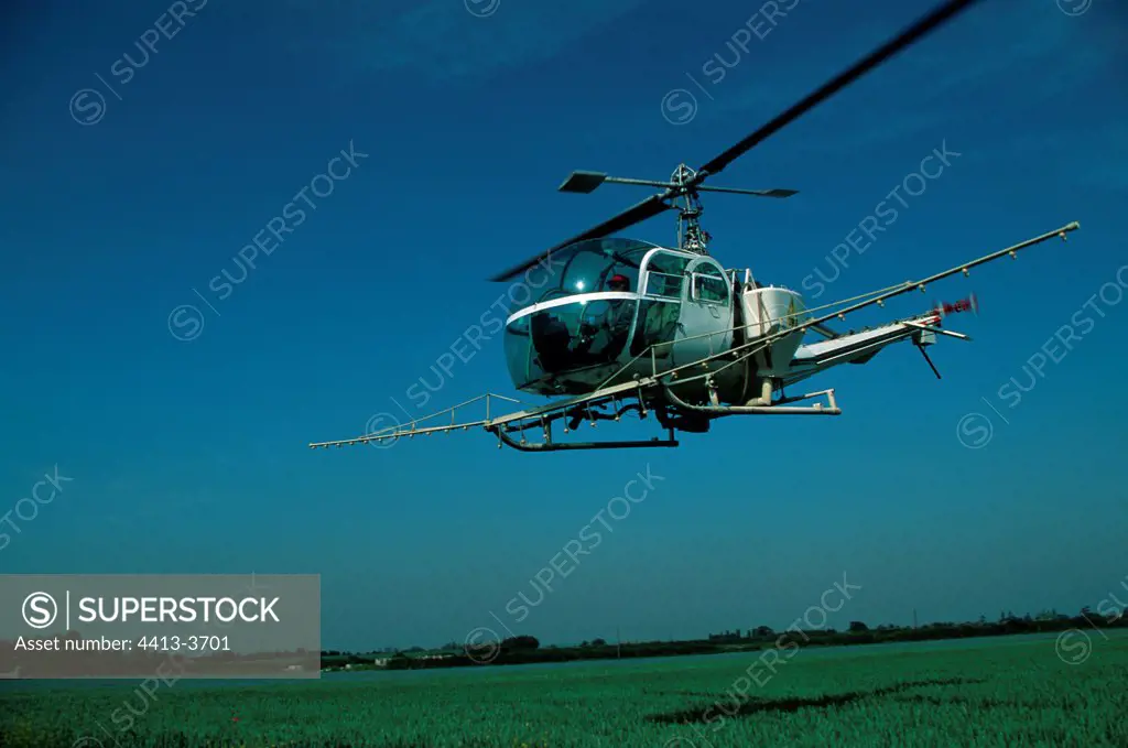 Helicopter spraying crops CotswoldsUnited Kindom