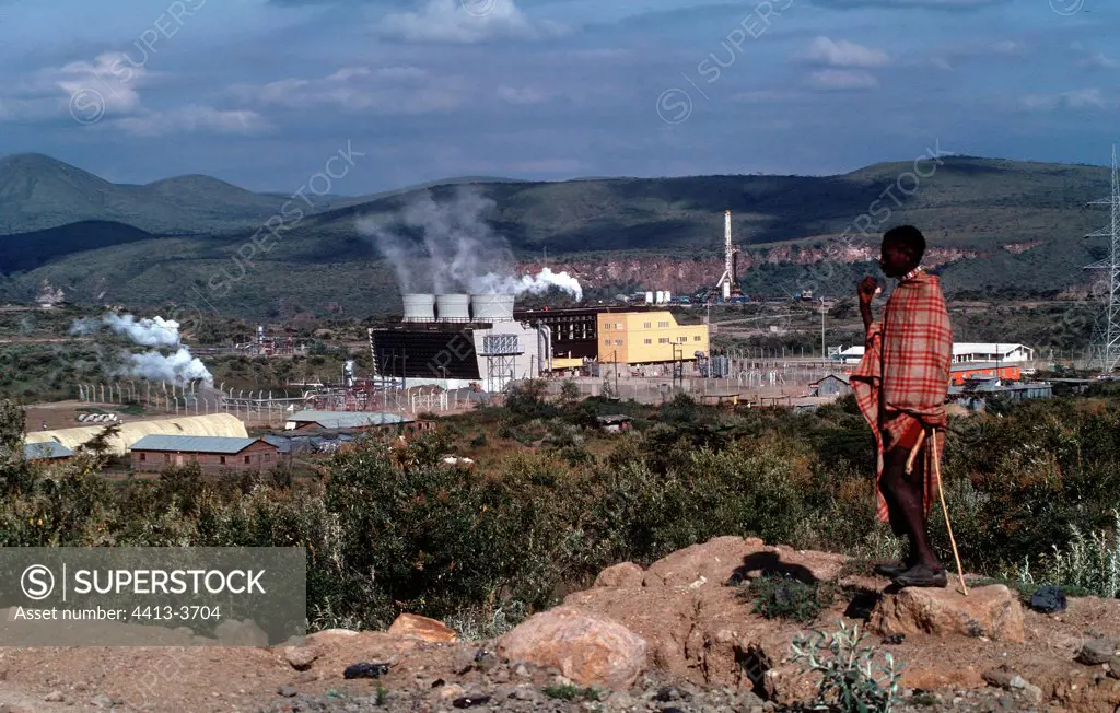 Masai tribesman looking at geothermal power station