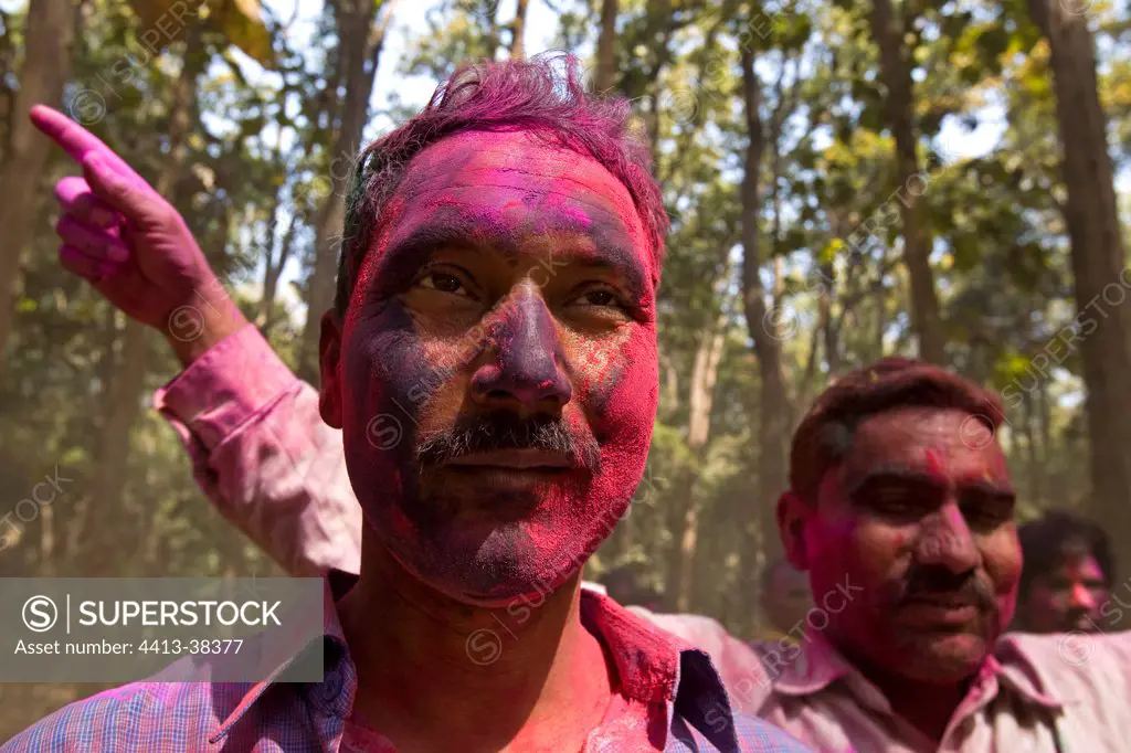People colored with powder at a holy festival