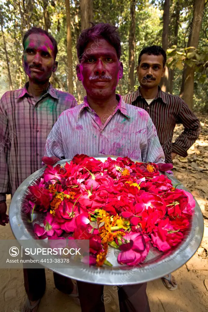 Offering flowers in a festive ritual Uttar Pradesh