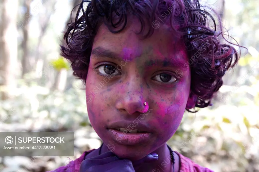 Young Boy with the face colored during a holy festival India