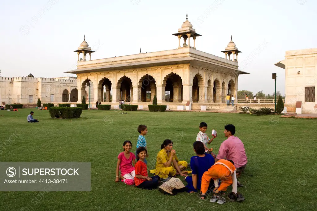 Family eating in the garden of the Red Fort Delhi India