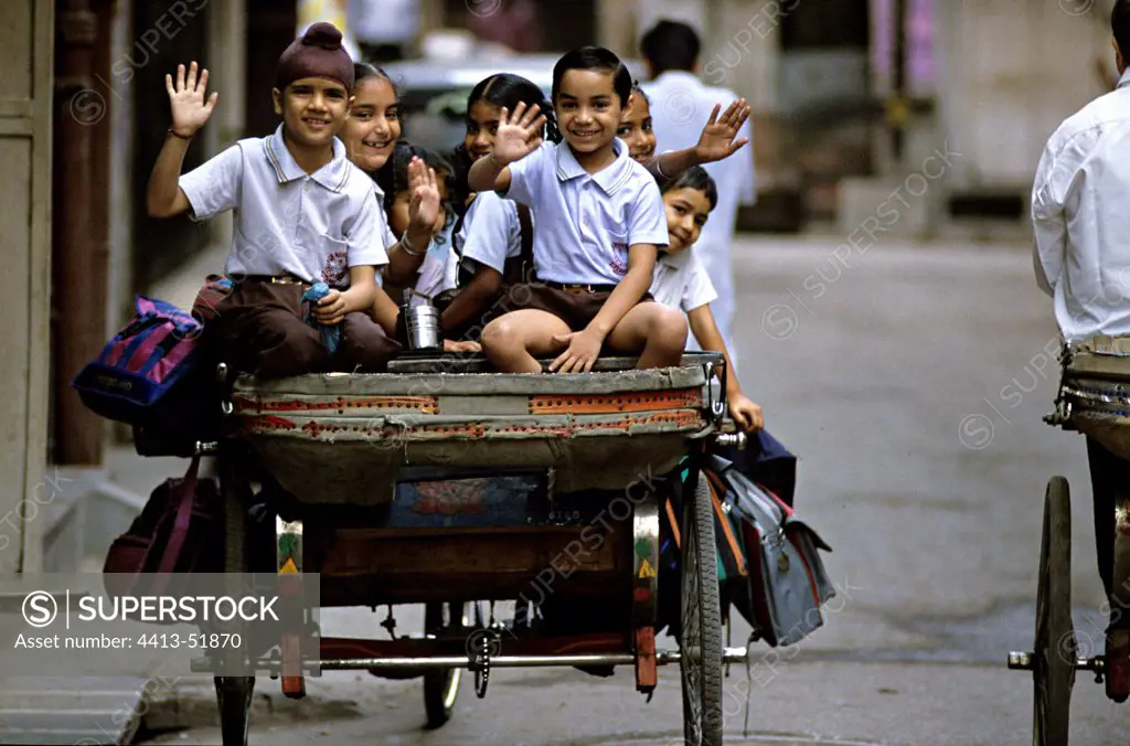 Schoolchildren in rickshaw Amritsar Punjab India