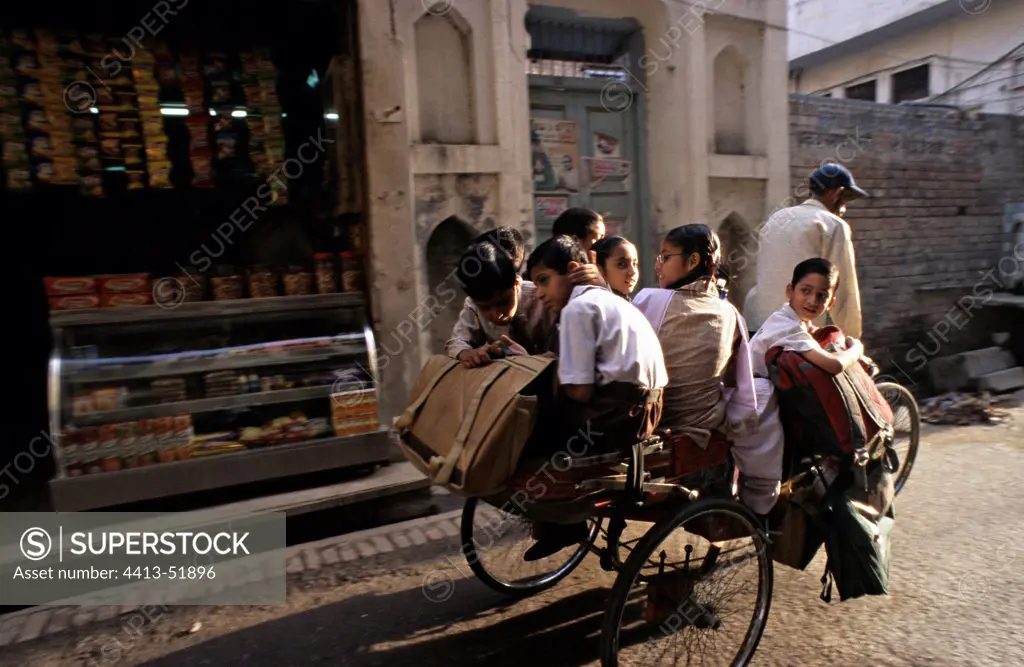 Schoolchildren in rickshaw Amritsar Punjab India
