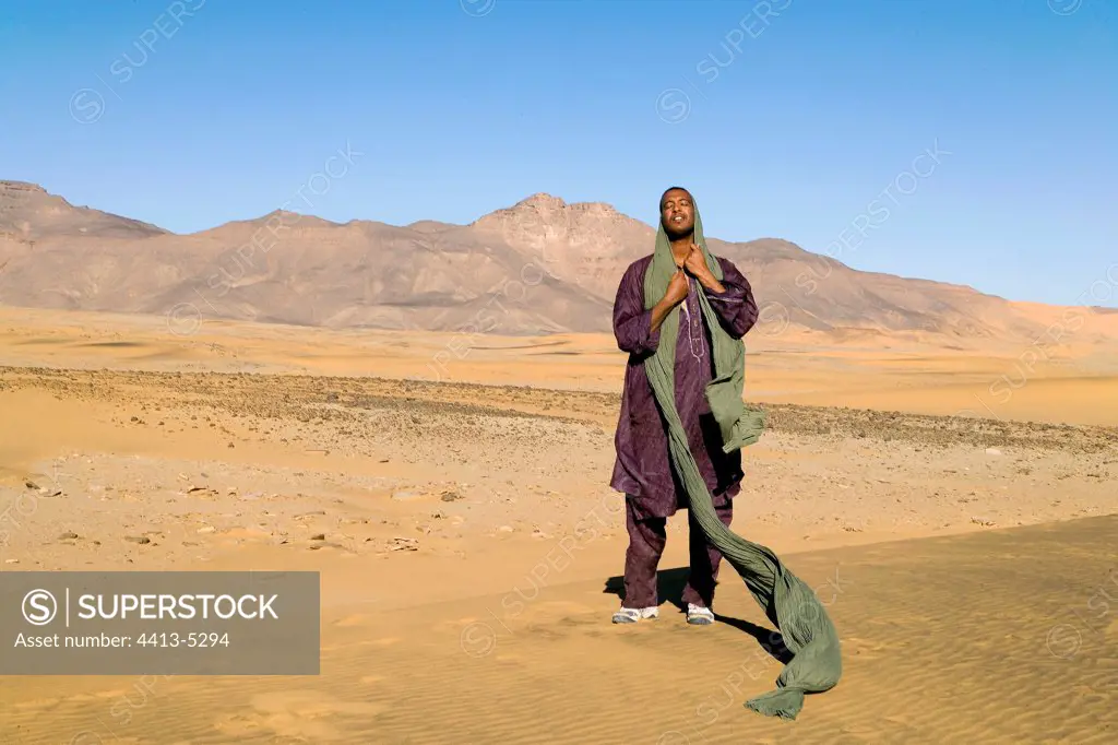 Tuareg giving its chech on a dune Sahara Algeria