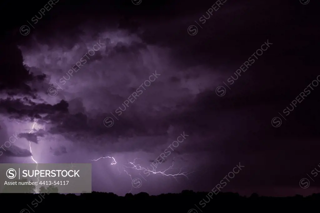 Lightning strike and intercloud lightning at nightFrance