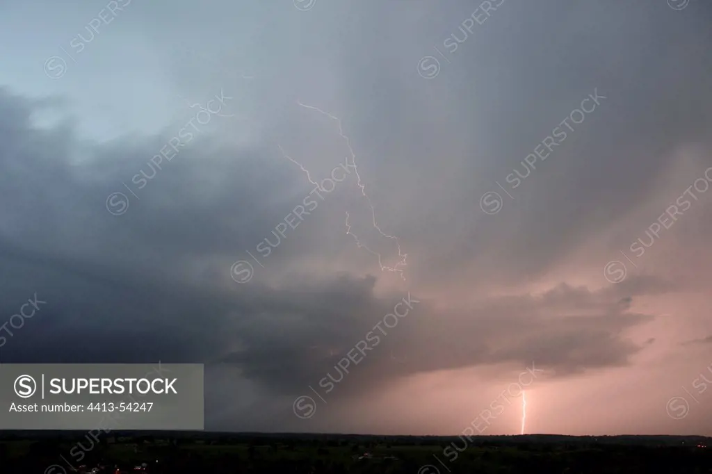 Lightning strike and intercloud lightning at eveningFrance