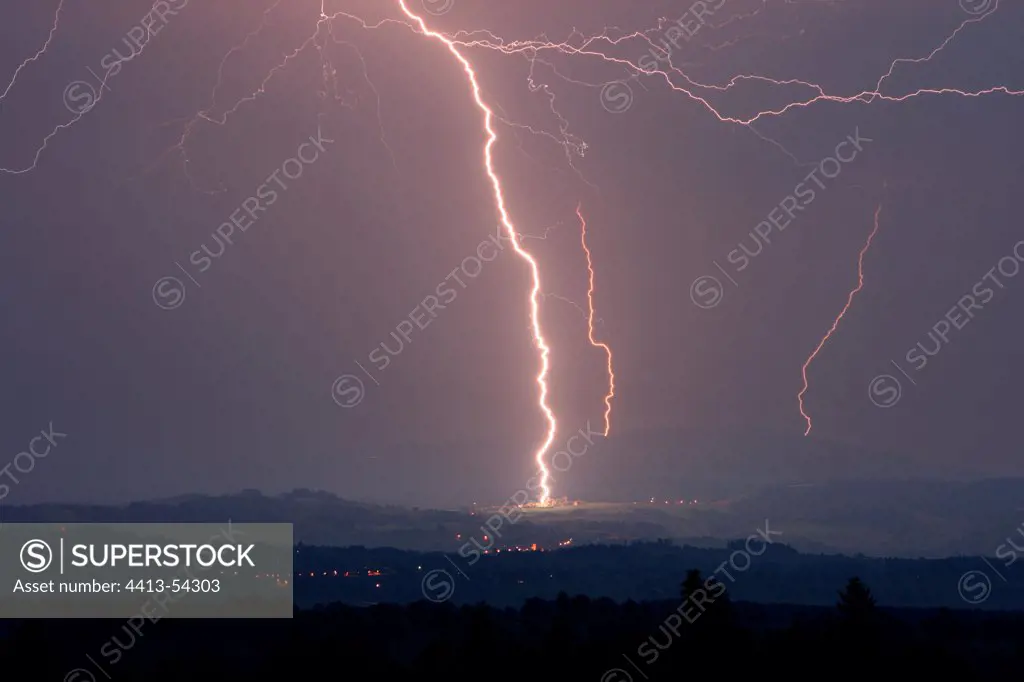 Powerful lightning strike striking a village Loire France