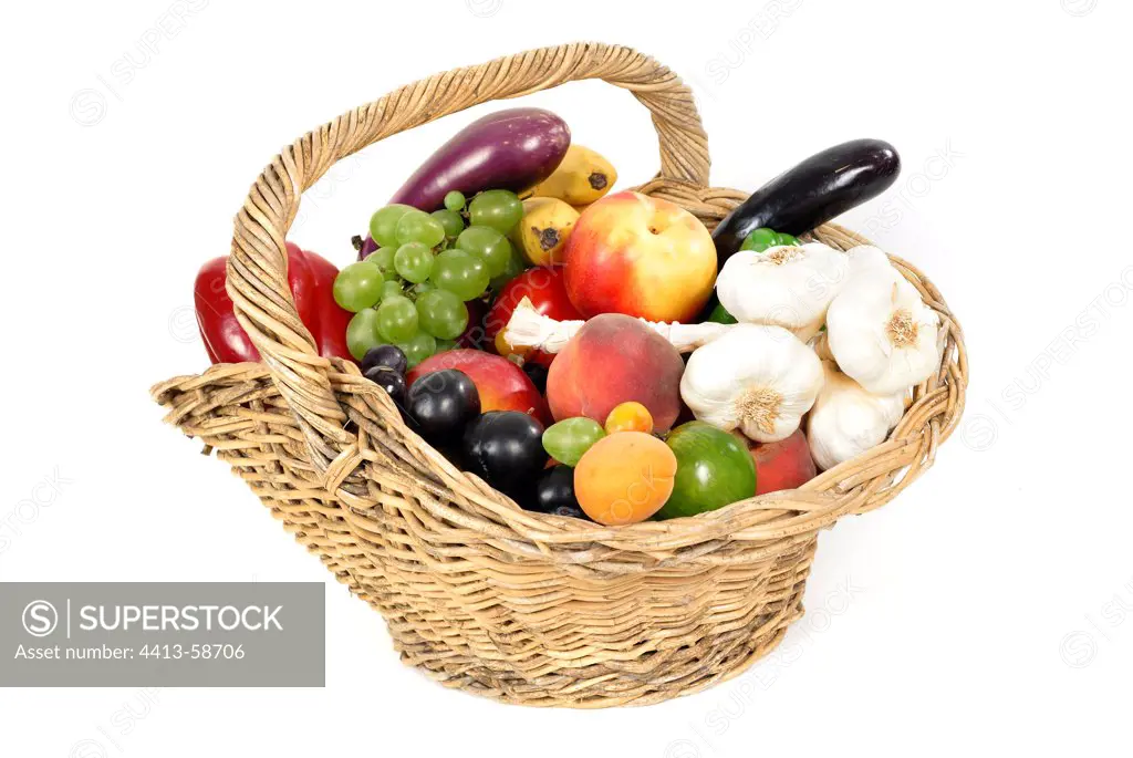 Basket of fruit and vegetables in summer studio