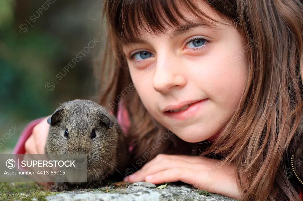 Girl with a Guinea pig France