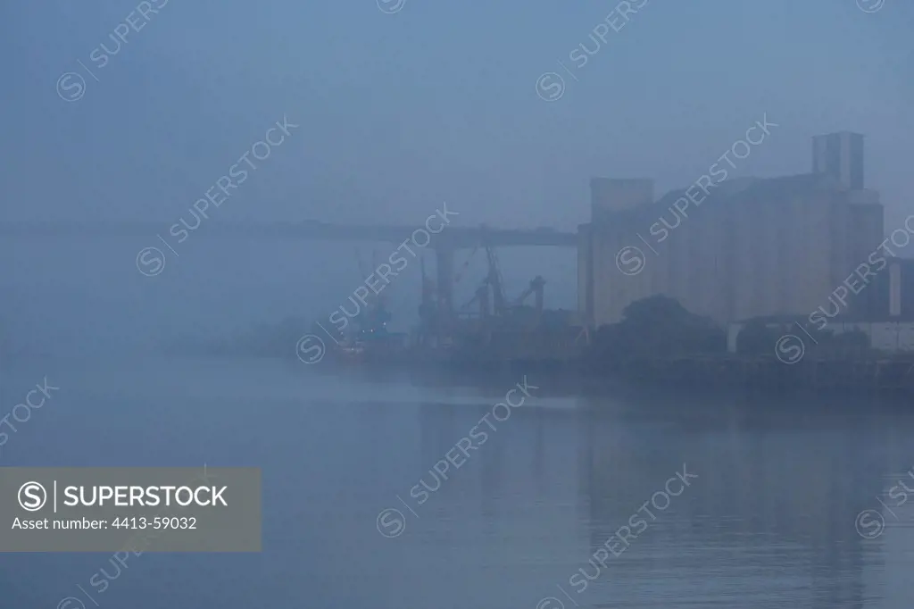 Dock and bridge in fog on the Loire Nantes France
