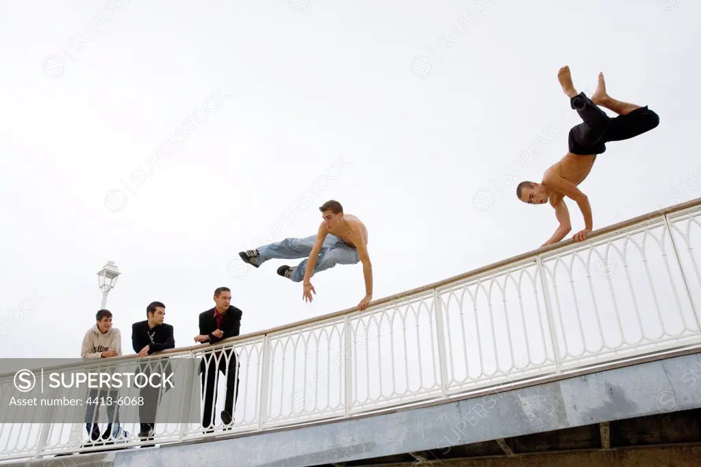 Young men jumping a guardrail France