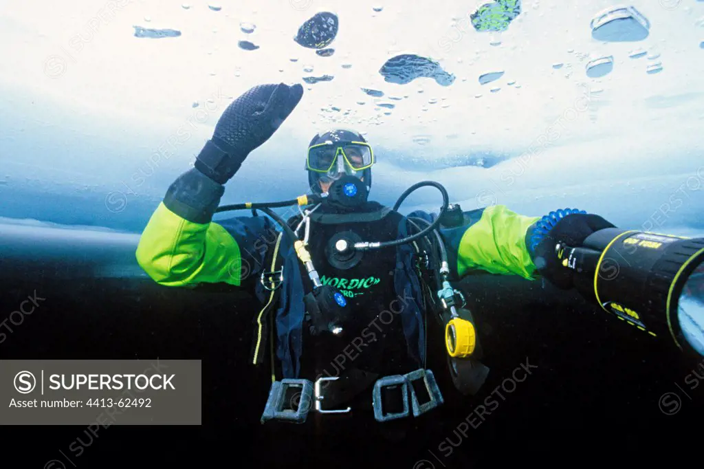 Diver under the ice at Lake Ceillac Queyras