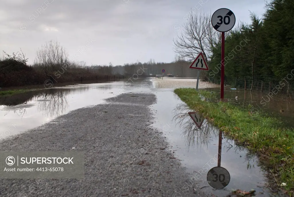 Flooded road during winter storm France