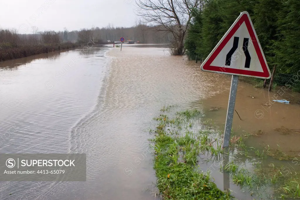 Flooded road during winter storm France