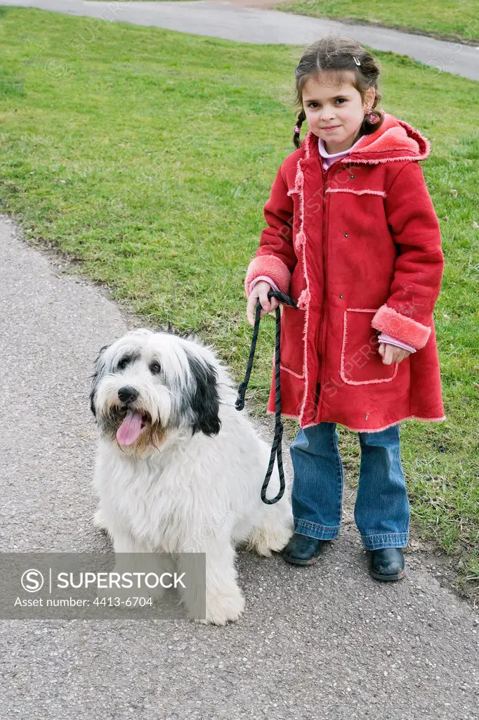 Girl handing in leash her Polish Lowland Sheepdog France