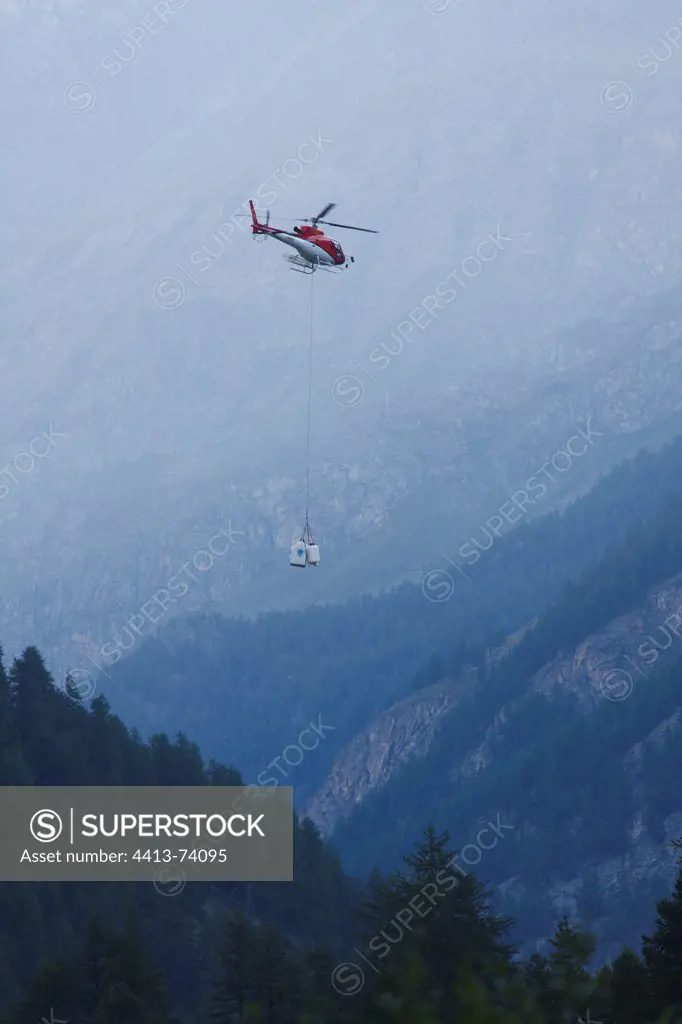 Helicopter refueling a refuge Gran Paradiso NP Italy