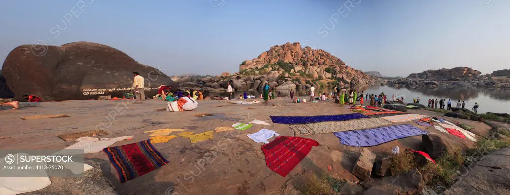 Towel drying on the shore Vijayanagara Hampi India