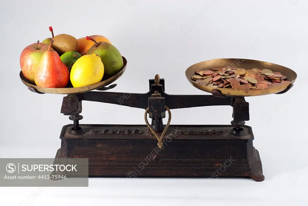 Former balance with fruit and coins