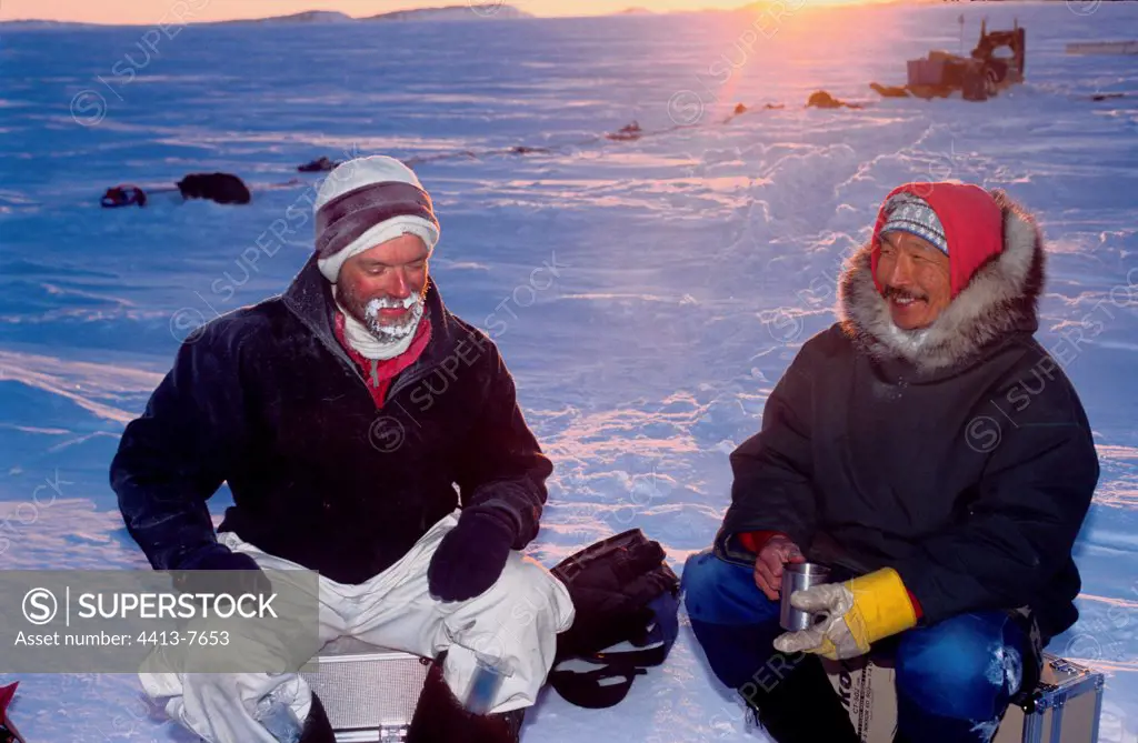 Explorer and inuit hunter on the ice-barrier Arctic