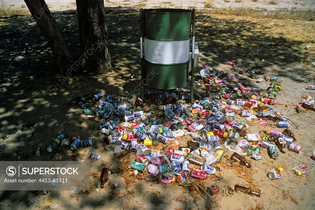 Cans and bottles around a trash bin Caprivi Namibia