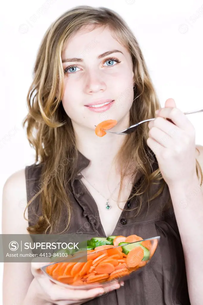 Girl eats an edge of Carot