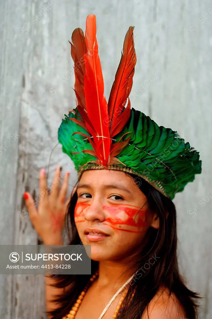 Young girl Kaxinawa wearing a traditional head-dress Brazil