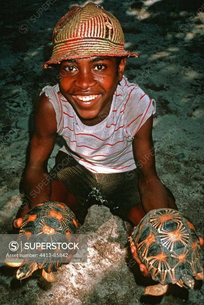 Salesman with protected Radiated Tortoises Madagascar
