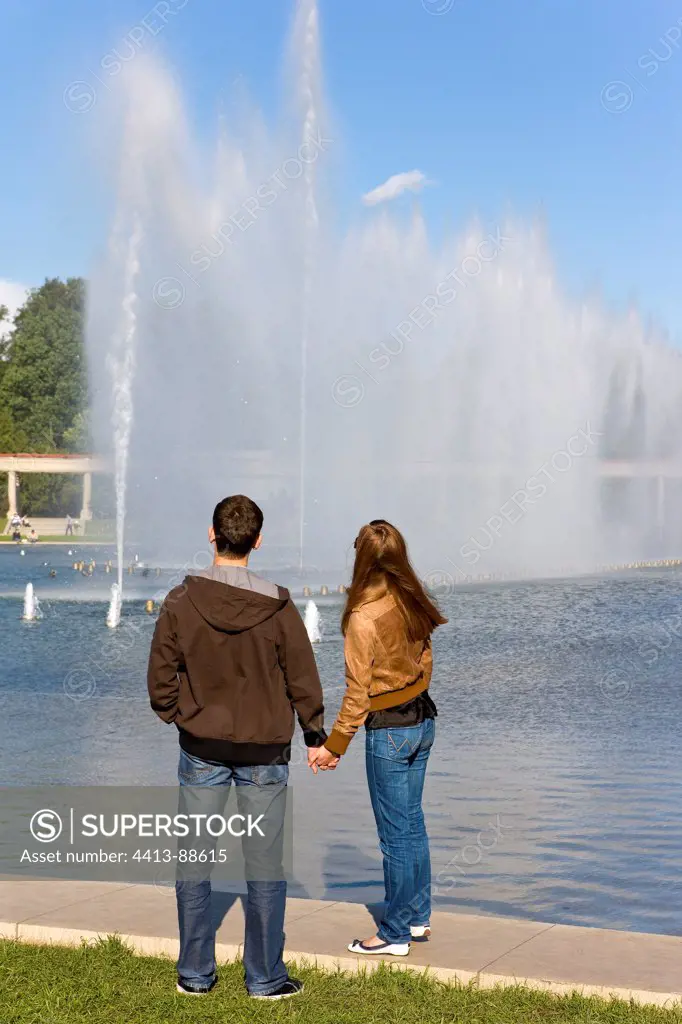 Young couple in front of a musical fountain Wroclaw Poland