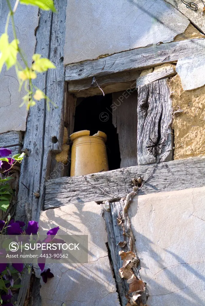 Jug on the ledge of a half-timbered house window