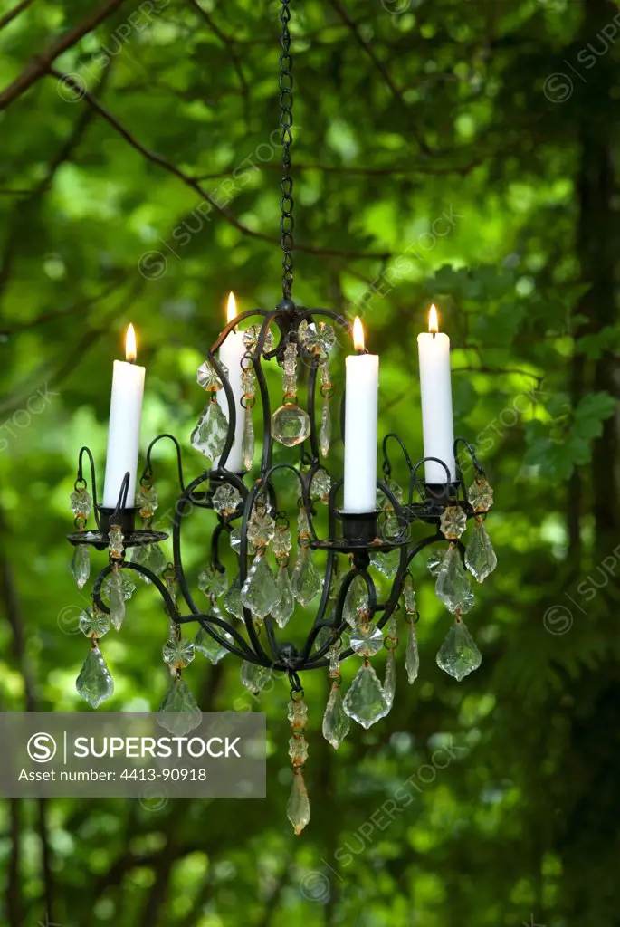Candelabrum with candles in a garden