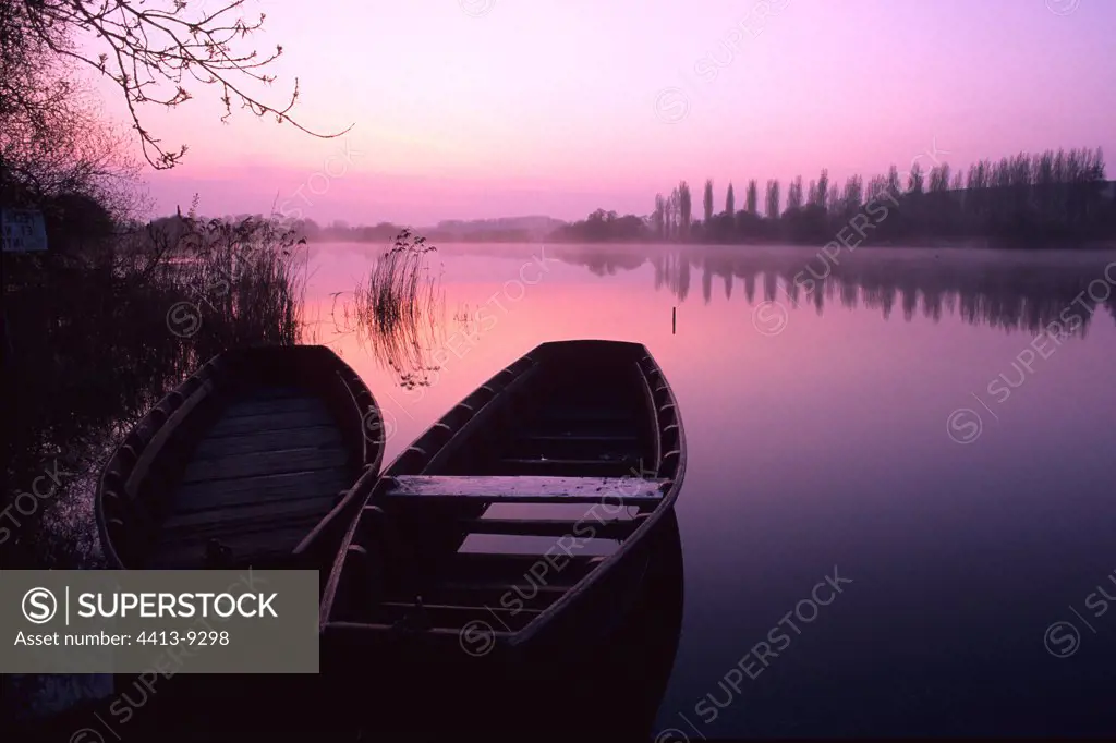 Boats in the marsh of Goulaine at sunrise France