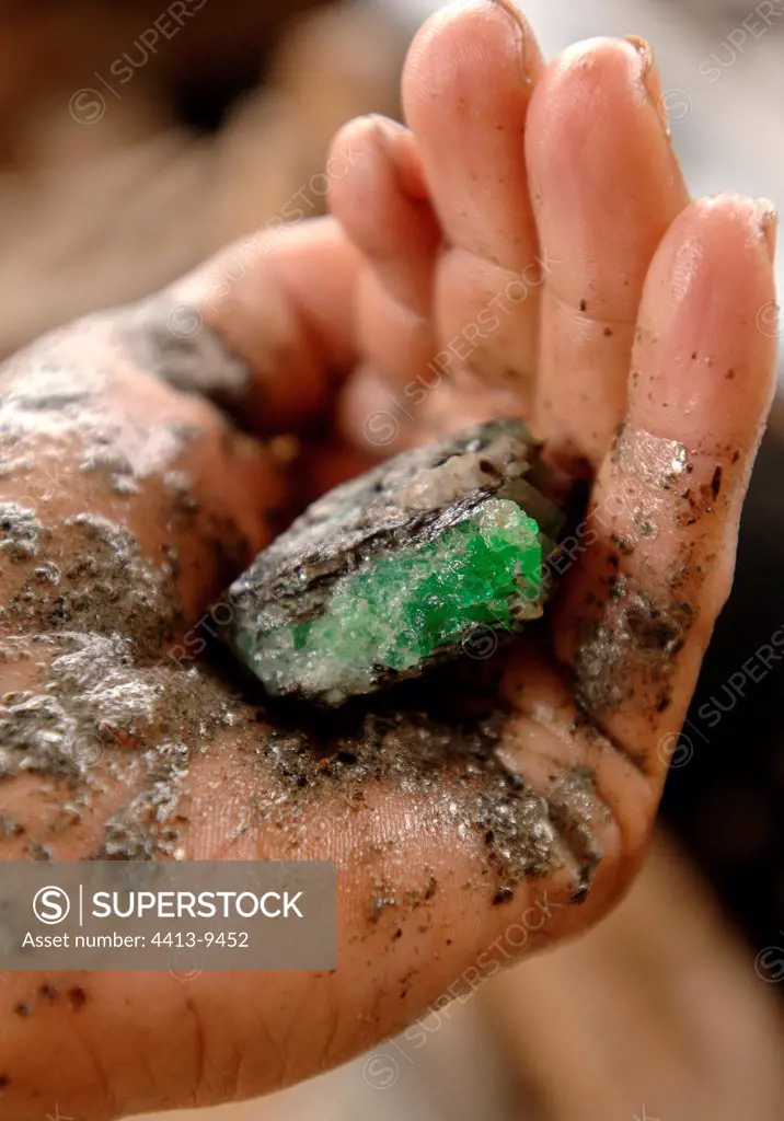 Crude emerald in a hand Minas Gerais Brazil