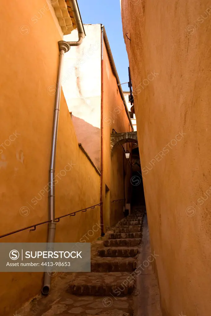 Alley between houses in the village of Roussillon Vaucluse