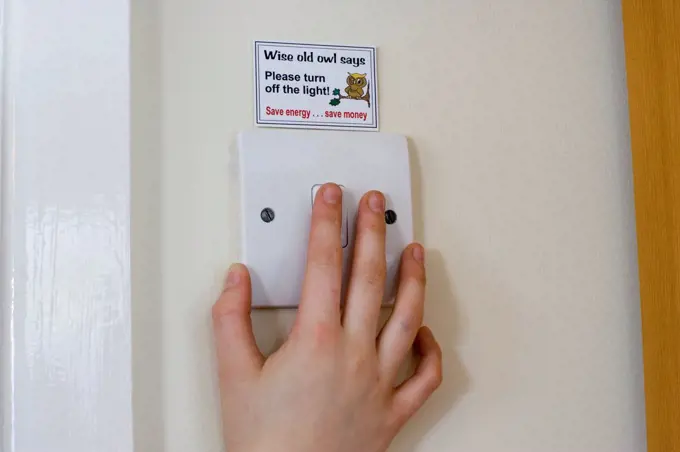Energy saving sticker above light switch