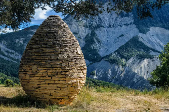 Sentinel, Andy Goldsworthy, 1999, Col du Defens, Alpes de haute Provence, France "The work Sentinels, which is part of the Refuge d'art project, is a journey through the Dignois region, at the foot of the Southern Alps. Such a project associates art, nature and the territory. The three Sentinels are stone cairns, one for each of the three valleys of the Haute-Provence Geological Reserve.