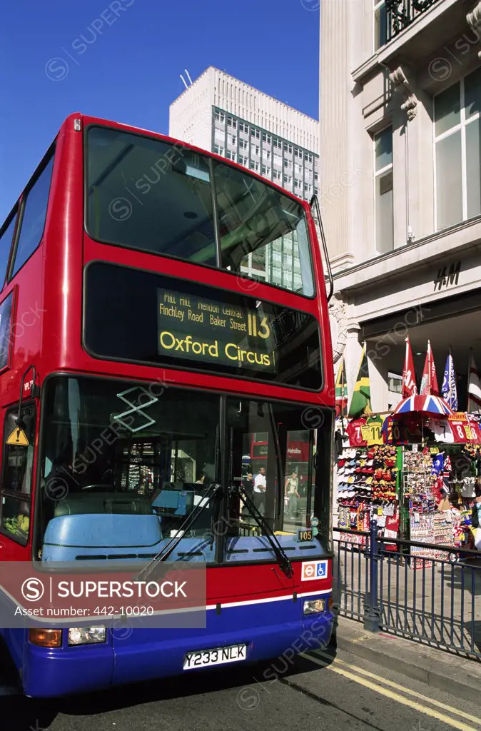 Low angle view of a double-decker bus on a road, London, England