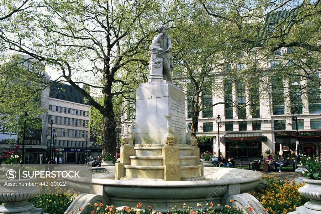Low angle view of a statue in front of a building, William Shakespeare Statue, Leicester Square, London, England