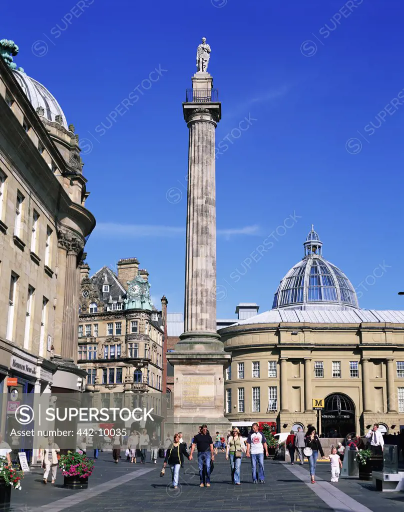 Tourists in front of a monument, Grey's Monument, Newcastle Upon Tyne, England