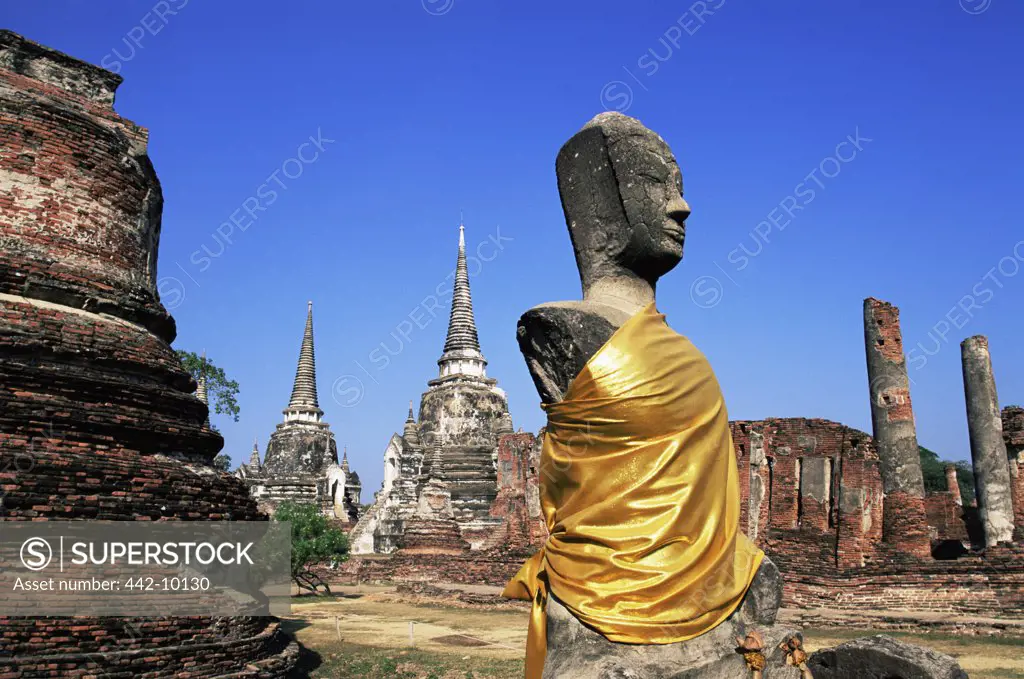 Low angle view of a statue of Buddha at a temple, Wat Phra Si Sanphet, Ayutthaya, Thailand