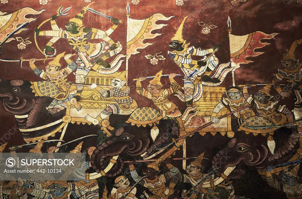 Close-up of a mural on the wall of a temple depicting a battle scene from the Ramakien Epic, Wat Mahathat, Phetchaburi, Thailand
