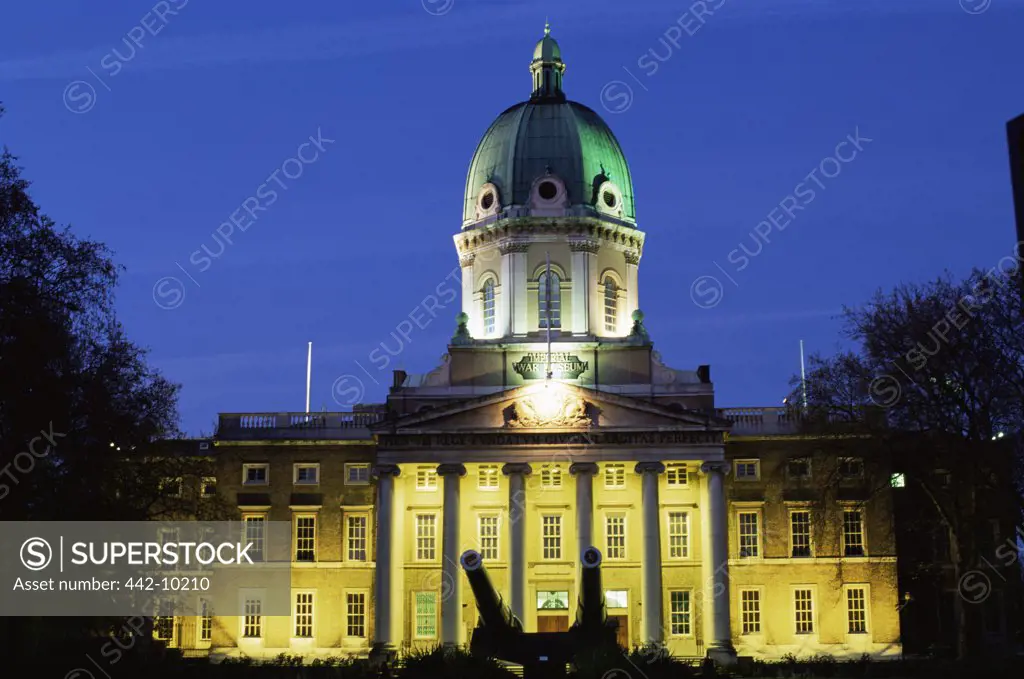 Facade of a museum lit up at night, Imperial War Museum, London, England