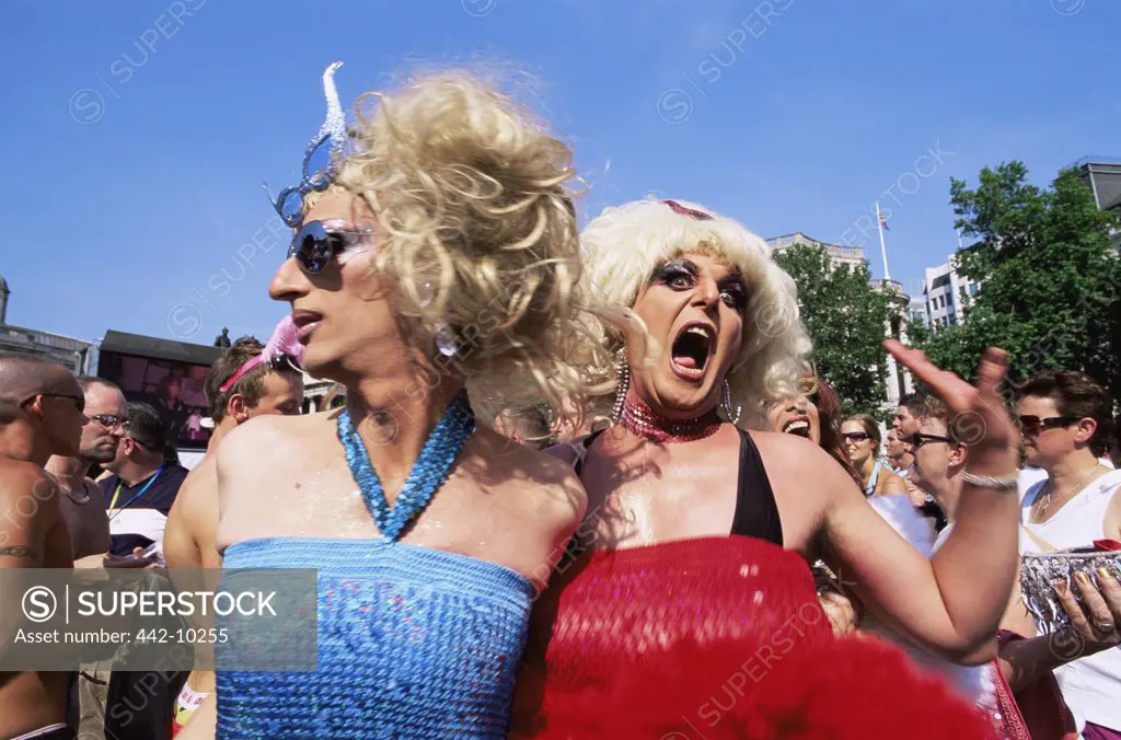 Two gay men participating in a gay pride parade, Trafalgar Square, London, England