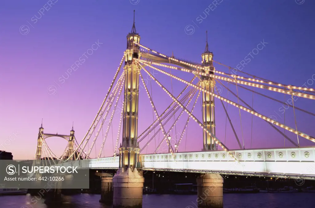 Bridge lit up at dusk, Albert Bridge, Chelsea, London, England