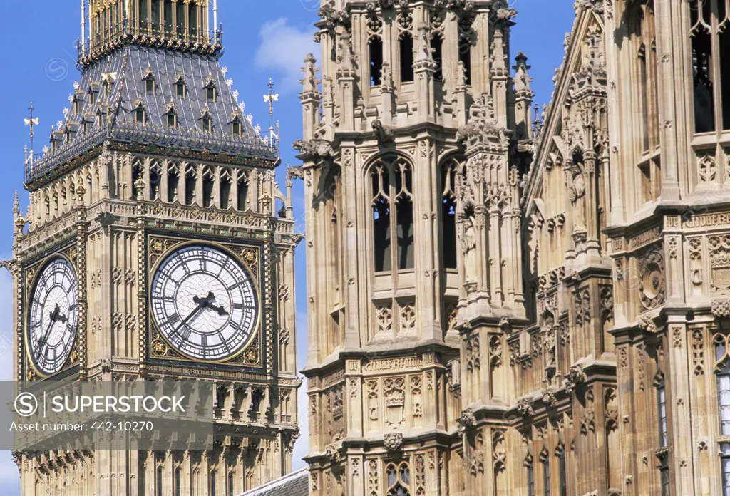 Low angle view of a clock tower of a government building, Big Ben, Westminster, London, England