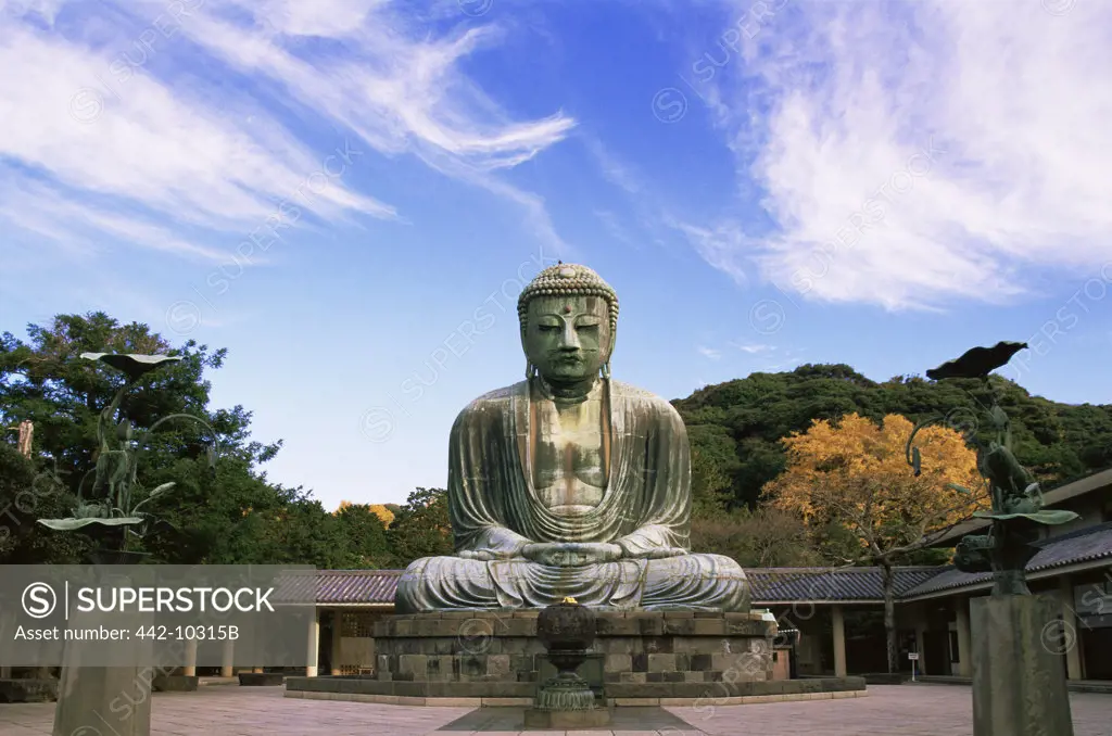 Buddha in front of a building, Daibutsu (Great Buddha), Kamakura, Tokyo, Japan