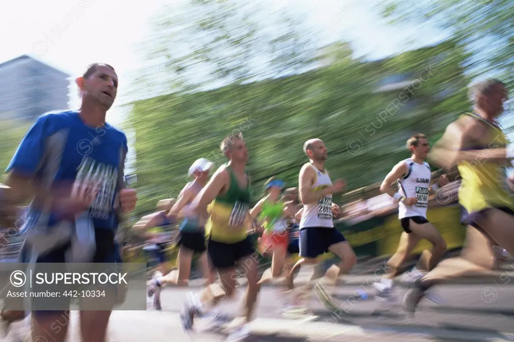 Group of people running in a marathon, London, England