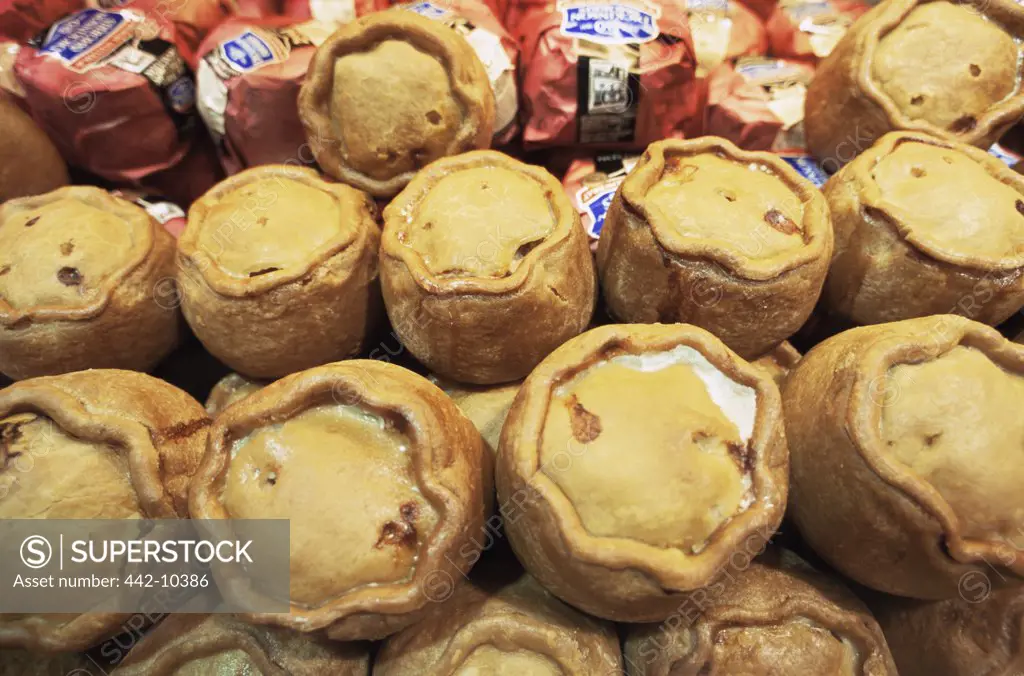 Close-up of pork pies in the display window of a store, Ye Olde Pork Pie Shoppe, Melton Mowbray, Leicestershire, England